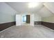 Spacious bonus room featuring neutral colors and carpeting with an opening to another room at 858 Cedar Wood, Carmel, IN 46032
