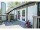 Exterior deck area with double doors and a pot of flowers at 858 Cedar Wood, Carmel, IN 46032