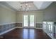 Formal dining room with chandelier lighting, decorative walls, and hardwood floors at 858 Cedar Wood, Carmel, IN 46032
