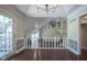 Open dining room with hardwood floors, decorative walls and access to a balcony at 858 Cedar Wood, Carmel, IN 46032