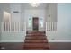 Grand entryway featuring hardwood floors, a staircase, and a charming front door at 858 Cedar Wood, Carmel, IN 46032