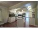 Bright kitchen boasts stainless appliances, a center island, granite counters, and access to the backyard at 858 Cedar Wood, Carmel, IN 46032