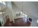 Open concept living room with wood floors, fireplace, and high vaulted ceilings at 858 Cedar Wood, Carmel, IN 46032