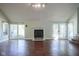 Open-concept living room features a fireplace, hardwood floors, and bright natural light at 858 Cedar Wood, Carmel, IN 46032