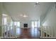 Spacious living room with vaulted ceilings, a fireplace, and hardwood flooring at 858 Cedar Wood, Carmel, IN 46032