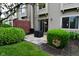 Charming townhome backyard with patio area, green bushes, and garden beds at 9154 Sea Oats Dr, Indianapolis, IN 46250