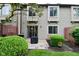Townhome exterior with patio area, well-maintained landscaping, and inviting outdoor space at 9154 Sea Oats Dr, Indianapolis, IN 46250