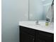 Powder room featuring black cabinets and white countertop with modern fixtures at 9154 Sea Oats Dr, Indianapolis, IN 46250