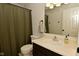 Well-lit bathroom featuring a vanity with a clean white sink and countertop, complemented by bronze fixtures at 9154 Sea Oats Dr, Indianapolis, IN 46250