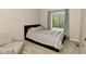 Cozy bedroom featuring a comfortable bed, chair, soft carpet, and natural light at 9154 Sea Oats Dr, Indianapolis, IN 46250