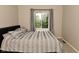 Comfortable bedroom featuring a bed, soft carpet, and natural light at 9154 Sea Oats Dr, Indianapolis, IN 46250