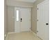 Entryway featuring a white front door with sidelight and neutral-colored walls at 9154 Sea Oats Dr, Indianapolis, IN 46250