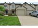 Charming townhome with well-manicured lawn and attached two-car garage at 9154 Sea Oats Dr, Indianapolis, IN 46250