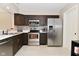 The spacious kitchen features stainless steel appliances, ample storage, and tiled backsplash at 9154 Sea Oats Dr, Indianapolis, IN 46250