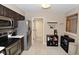 Functional kitchen with stainless steel appliances, tiled backsplash, and coffee bar at 9154 Sea Oats Dr, Indianapolis, IN 46250