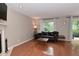 Bright living room with hardwood floors, modern decor, and lots of natural light at 9154 Sea Oats Dr, Indianapolis, IN 46250