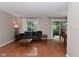 Open-concept living space with hardwood floors and access to the outdoor patio at 9154 Sea Oats Dr, Indianapolis, IN 46250