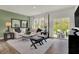 Stylish living room featuring a comfortable sectional sofa, modern accents, and ample natural light at 9363 Abner St, McCordsville, IN 46055
