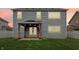 Spacious backyard featuring a covered patio with string lights and a well-maintained lawn at 951 Parker Ln, Westfield, IN 46074