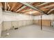 Spacious unfinished basement with concrete walls, exposed ceiling and beams for potential customization at 951 Parker Ln, Westfield, IN 46074