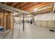 A spacious unfinished basement featuring concrete flooring, exposed beams, and utility connections at 951 Parker Ln, Westfield, IN 46074