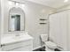 Bathroom featuring a vanity, mirror, toilet, and tiled tub with shower at 951 Parker Ln, Westfield, IN 46074