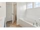The bathtub is large and bright in this well-lit bathroom at 951 Parker Ln, Westfield, IN 46074
