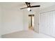 Bedroom featuring carpeted floors, a ceiling fan, and a closet with doors at 951 Parker Ln, Westfield, IN 46074