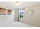 Bright bedroom featuring carpeted floors, a window, and modern lighting at 951 Parker Ln, Westfield, IN 46074