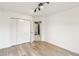 Bedroom featuring wood floors, a closet with doors and overhead track lighting at 951 Parker Ln, Westfield, IN 46074