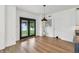 Bright dining area featuring modern lighting, hardwood floors, and access to a backyard at 951 Parker Ln, Westfield, IN 46074