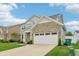 Charming two-story home featuring stone accents, a two-car garage, and a well-maintained lawn at 951 Parker Ln, Westfield, IN 46074