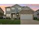 Beautiful two-story home featuring stone accents, a two-car garage, and a well-manicured front lawn at 951 Parker Ln, Westfield, IN 46074