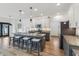 Modern kitchen featuring an island with seating, granite countertops, and stainless steel appliances at 951 Parker Ln, Westfield, IN 46074