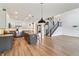 Open concept kitchen with a large island, stainless steel appliances, and hardwood floors at 951 Parker Ln, Westfield, IN 46074