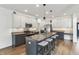 Contemporary kitchen featuring a large island with seating, granite countertops, and stainless appliances at 951 Parker Ln, Westfield, IN 46074