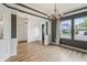 Bright living room featuring hardwood floors, white trim, and designer lighting at 951 Parker Ln, Westfield, IN 46074