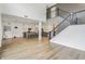 Open concept living room with kitchen in the background, featuring hardwood floors and plenty of space at 951 Parker Ln, Westfield, IN 46074