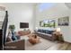 Staged living room with high ceilings, large windows, and comfortable seating arrangements at 951 Parker Ln, Westfield, IN 46074