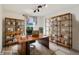 This home office has a large desk with shelving surrounding at 951 Parker Ln, Westfield, IN 46074
