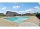 Community pool featuring a bathhouse and chairs with views of neighboring homes and a bright blue sky at 951 Parker Ln, Westfield, IN 46074