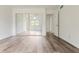 Bedroom with mirrored closet doors, hardwood floors, and natural light at 9572 Maple Way, Indianapolis, IN 46268