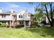Charming townhouse with a well-maintained lawn and beautiful landscaping at 9572 Maple Way, Indianapolis, IN 46268
