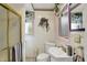 Bright bathroom features shower, toilet, and vanity with gold fixtures and colorful towels at 10036 E Troy Ave, Indianapolis, IN 46239