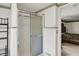 Bathroom featuring a glass shower with chrome frame and view of bedroom at 10036 E Troy Ave, Indianapolis, IN 46239