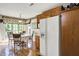 Dining room with wood floors, chandelier, and windows providing lots of natural light at 10036 E Troy Ave, Indianapolis, IN 46239