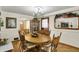 Charming dining room with a vintage chandelier and stylish wood accents at 10036 E Troy Ave, Indianapolis, IN 46239