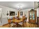 Traditional dining room featuring a decorative chandelier and wood furnishings at 10036 E Troy Ave, Indianapolis, IN 46239