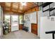 A cozy entryway with wood ceiling, brick walls, and view to outside at 10036 E Troy Ave, Indianapolis, IN 46239