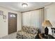 Cozy foyer area with a decorative sofa and front door at 10036 E Troy Ave, Indianapolis, IN 46239